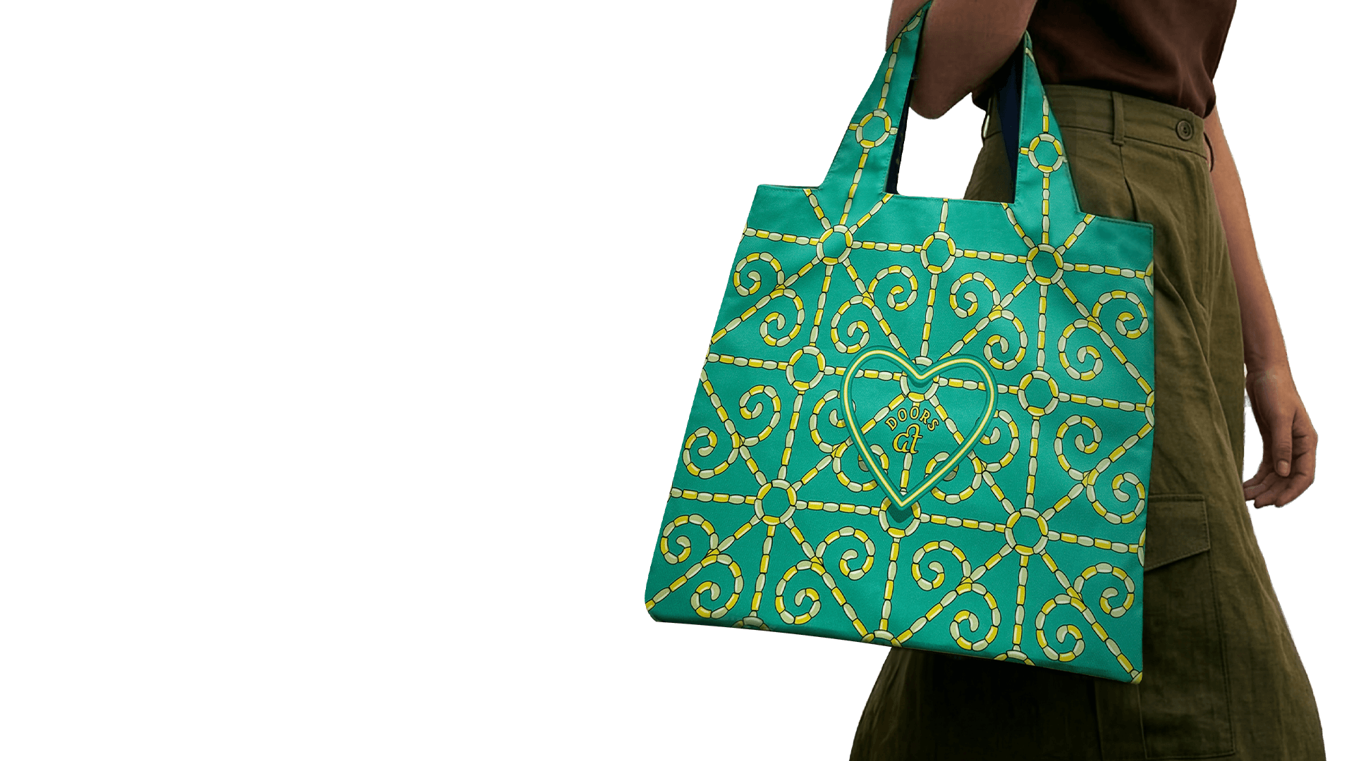 A woman carries the Doors at heart tote bag. ATHEART Creative Studio in Athens.