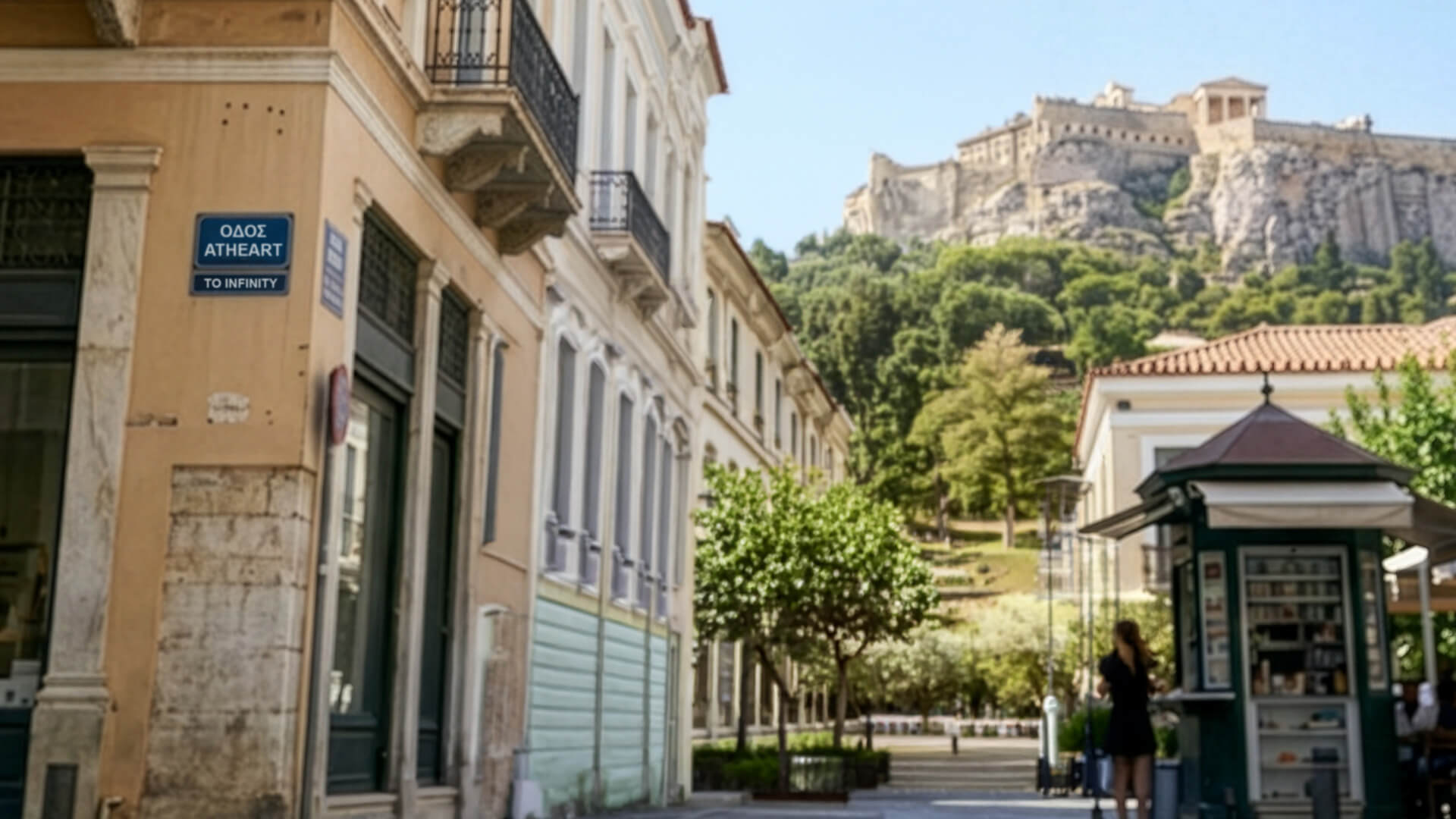 A street scene in Athens, Greece, with historic buildings, a newsstand, people walking, and the Acropolis on a hill in the background. A blue street sign reads “Odos Atheart – To Infinity.”.